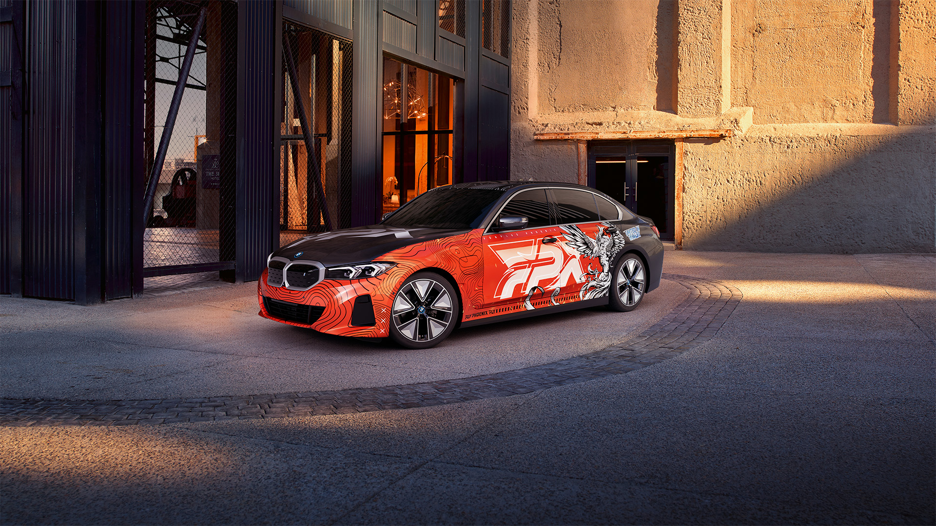 FPX team car in urban setting with golden hour lighting